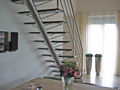 Middenboomtrap rvs met zwarte natuursteen treden
